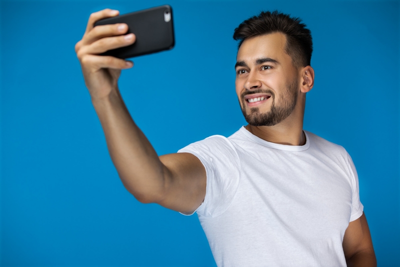 guy taking mobile phone selfie